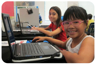 Two girls with computers